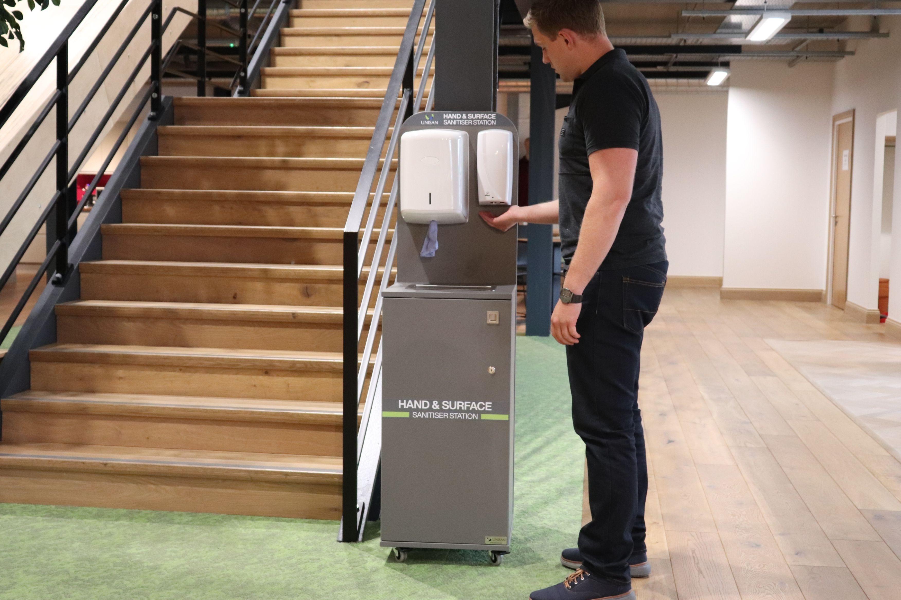 hand and surface sanitiser station on wheels with built in waste bin for ppe