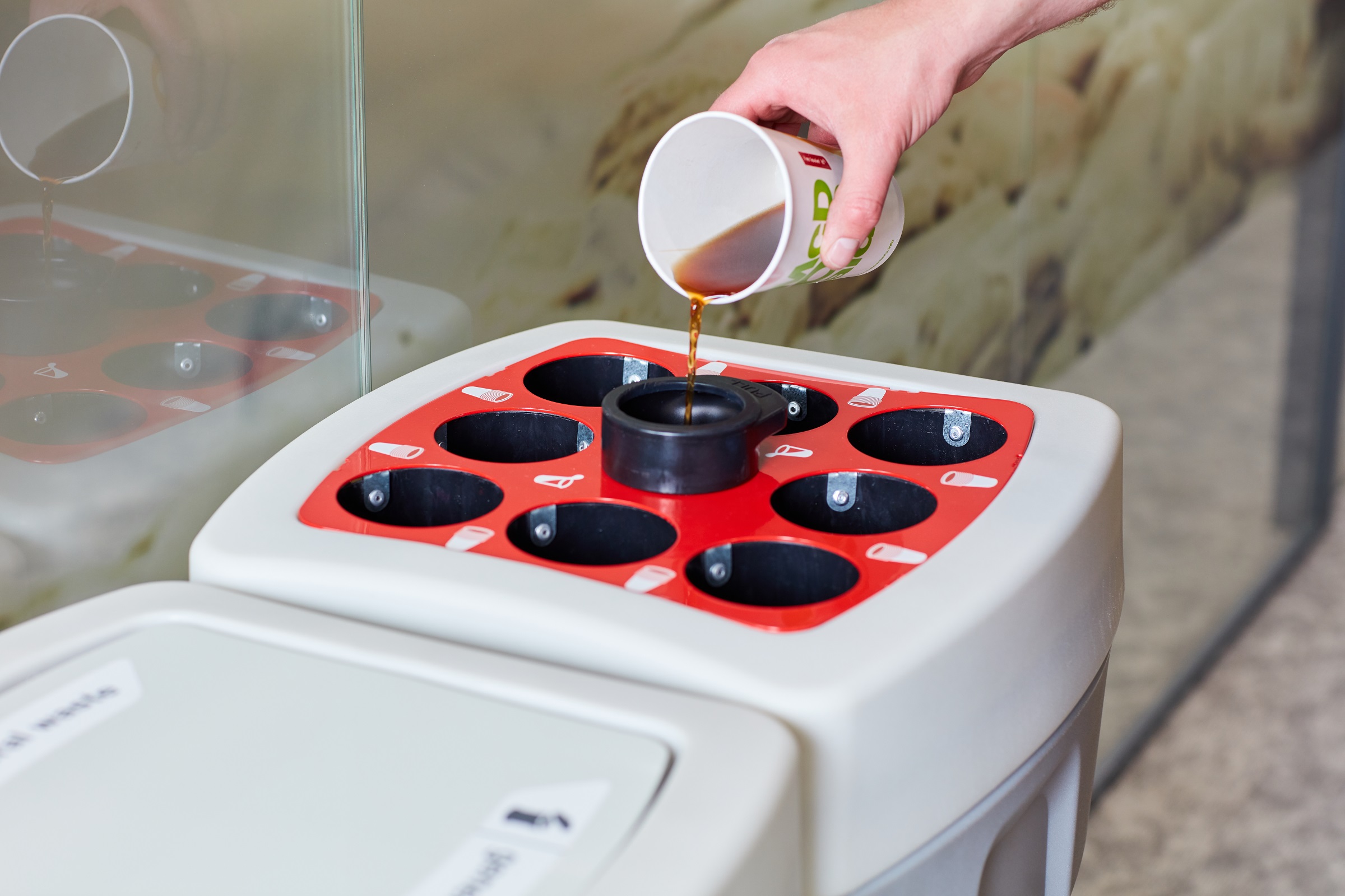 coffee cup and liquid disposal bin