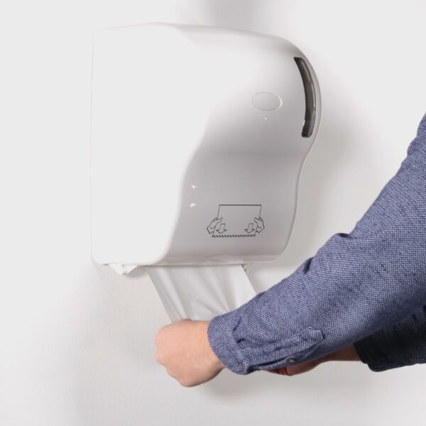 white paper towel roll in touchless dispenser